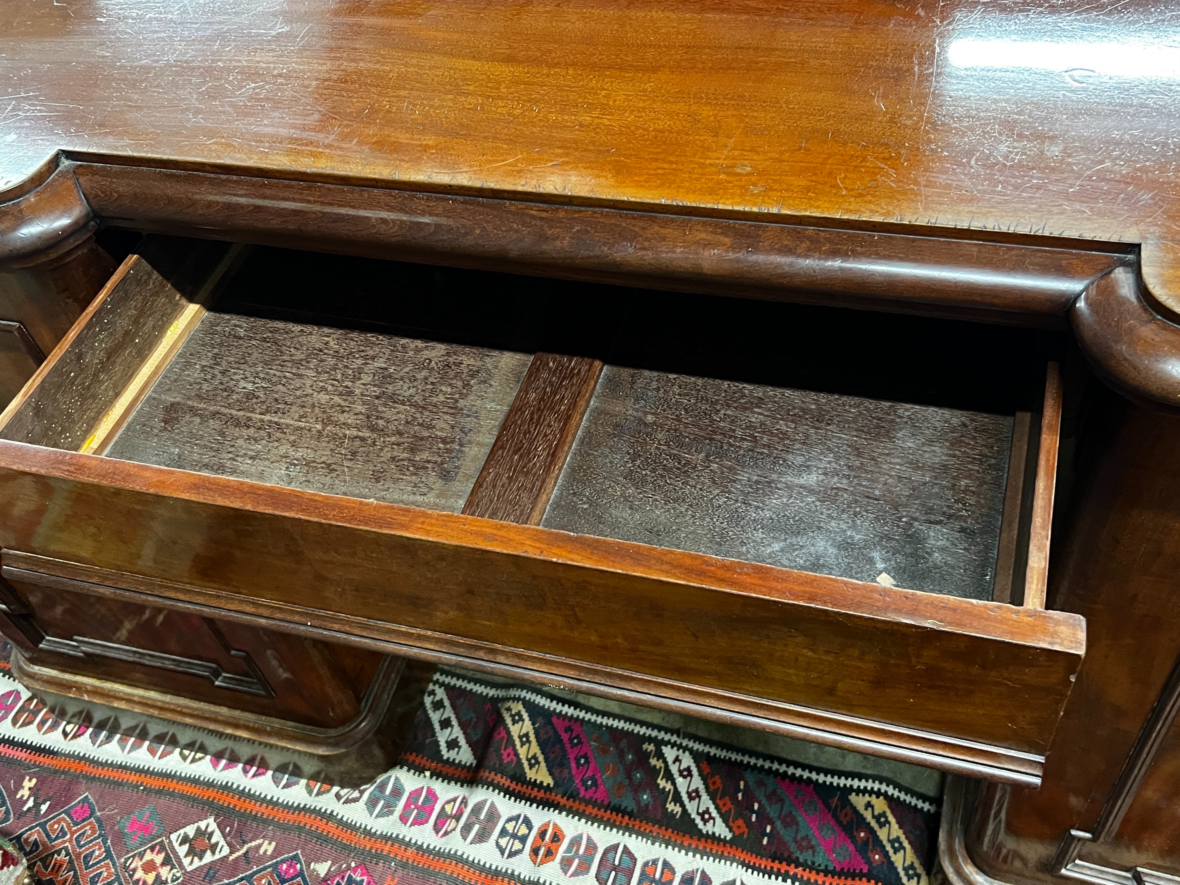 A Victorian mahogany inverse breakfront sideboard, length 180cm, depth 62cm, height 93cm